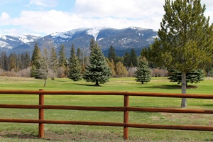 Overlooking the Double Arrow Resort golf course with the Swan mountains as a backdrop.